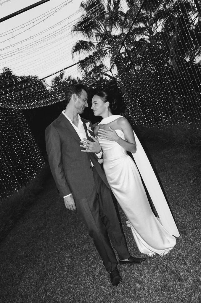 bride and groom wandering the grounds during their cabo wedding at baja luna