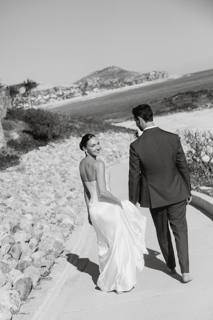 bride and groom at the beach in cabo during their destination wedding experience