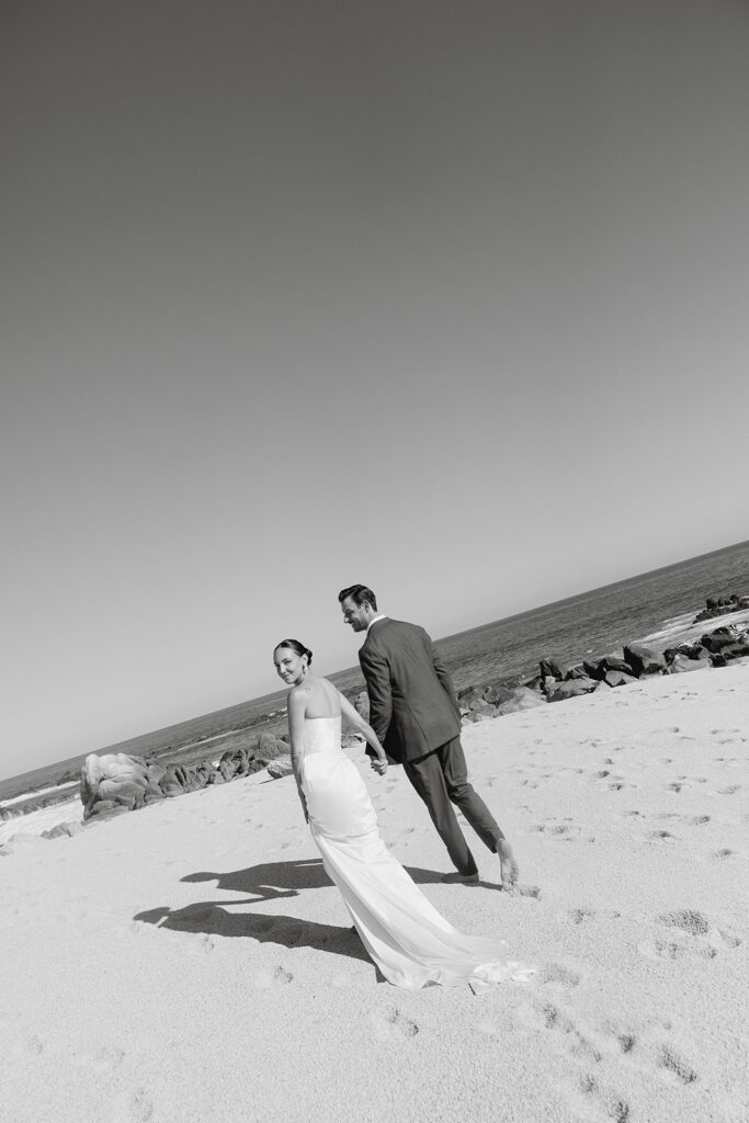 bride and groom at the beach in cabo during their destination wedding experience
