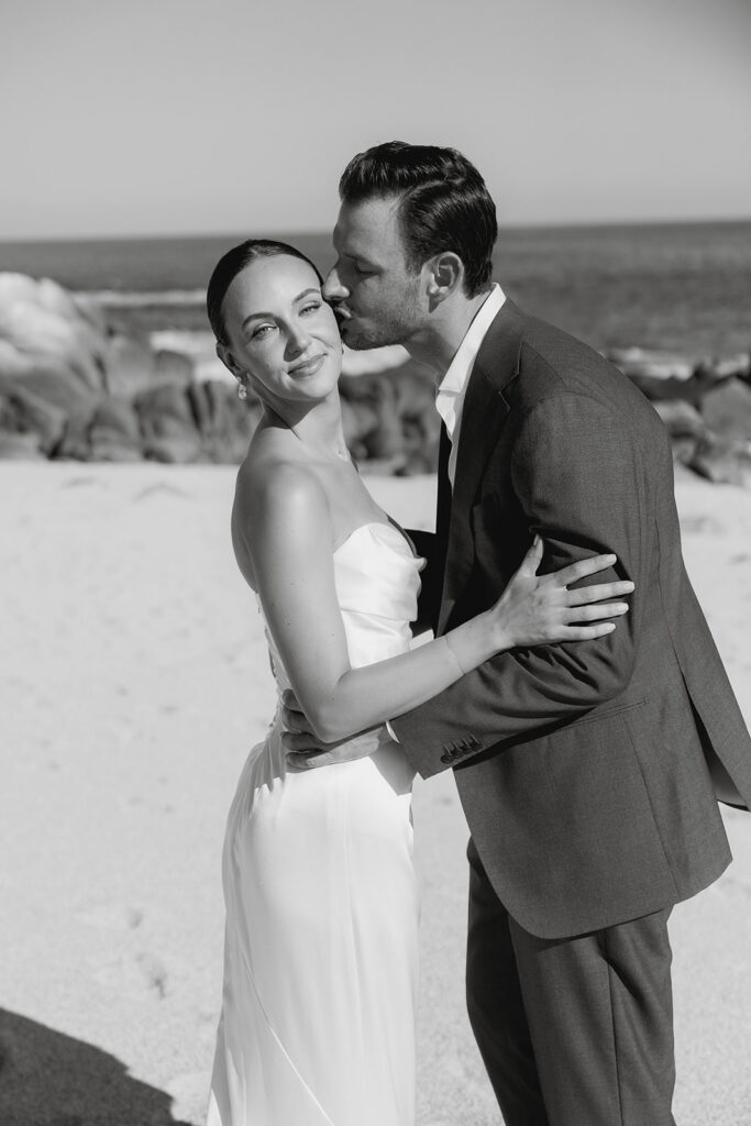 bride and groom at the beach in cabo during their destination wedding experience
