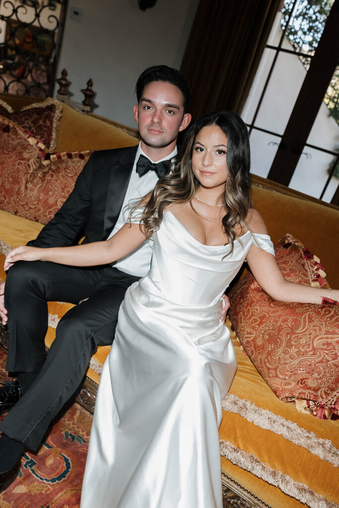 bride and groom taking photos inside the elegant rooms at the hummingbird nest ranch