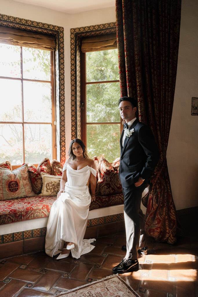bride and groom taking photos inside the elegant rooms at the hummingbird nest ranch