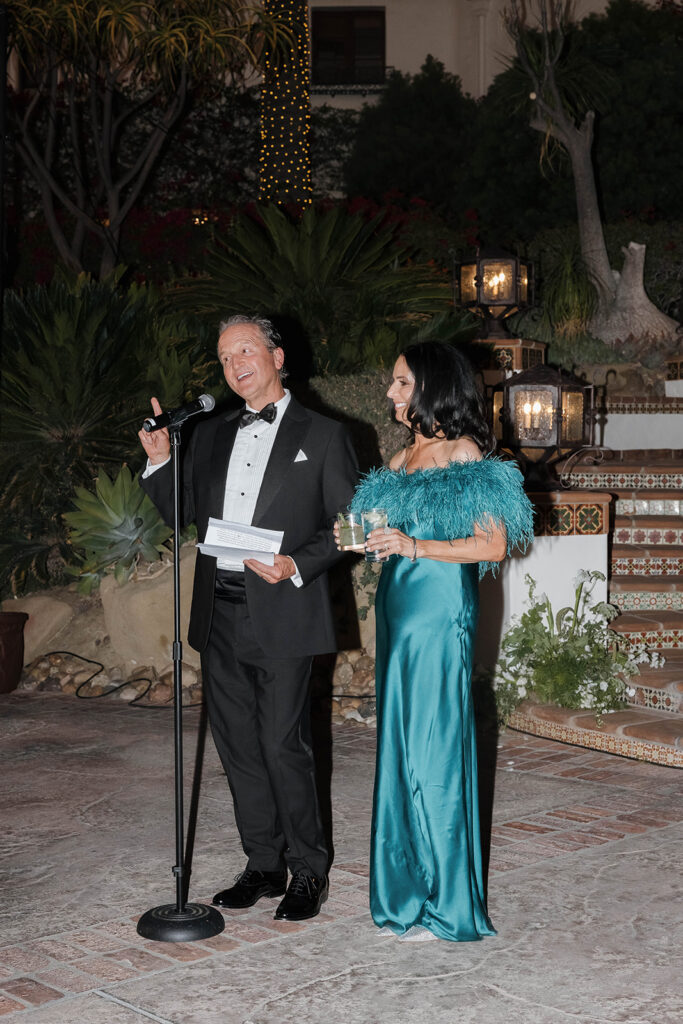 parents giving a speech at the reception