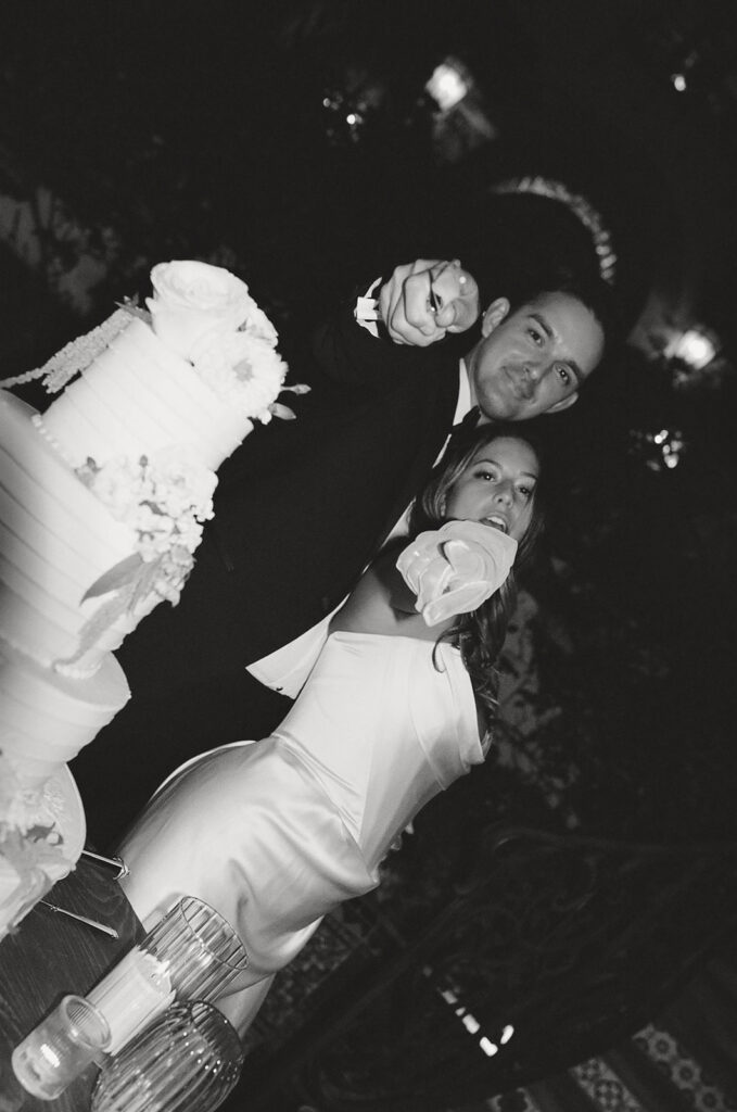 bride and groom cutting their wedding cake