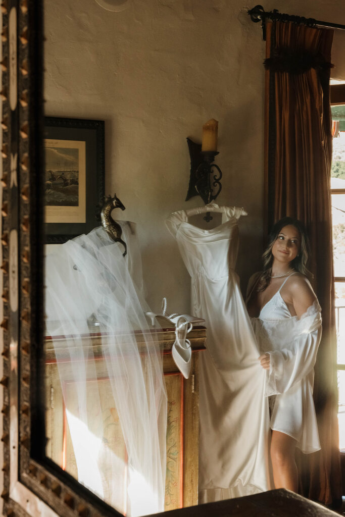 bride getting ready in a cozy spanish villa inspired room