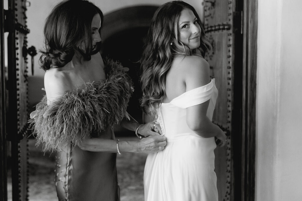 mom helping bride get ready