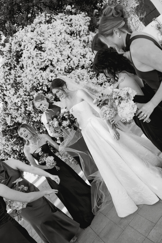 candid bride and bridesmaids moment
