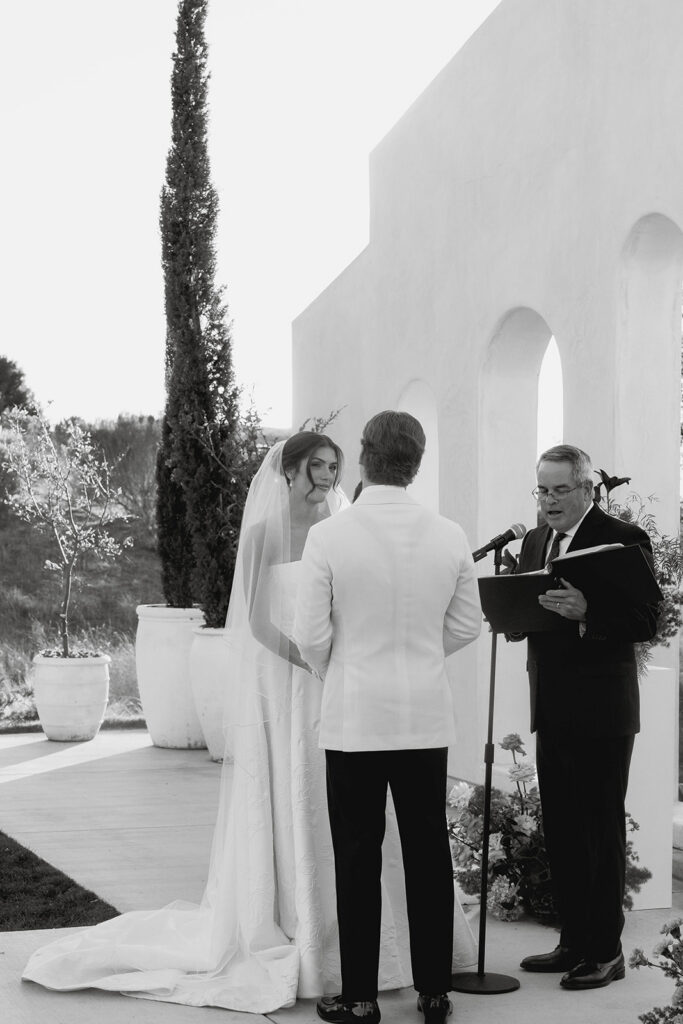 emotional bride and groom exchanging vows during their wedding ceremony at jeune perche estate