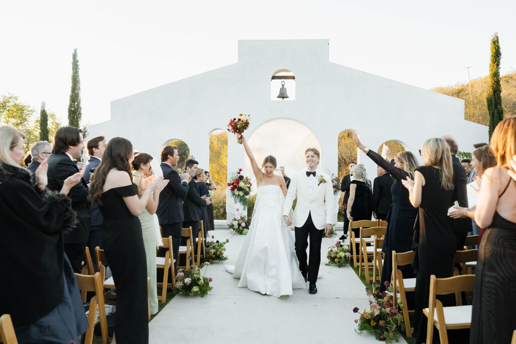 joyful bride and groom wedding ceremony exit