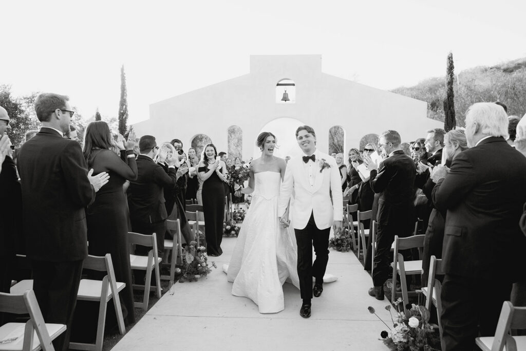 joyful bride and groom wedding ceremony exit