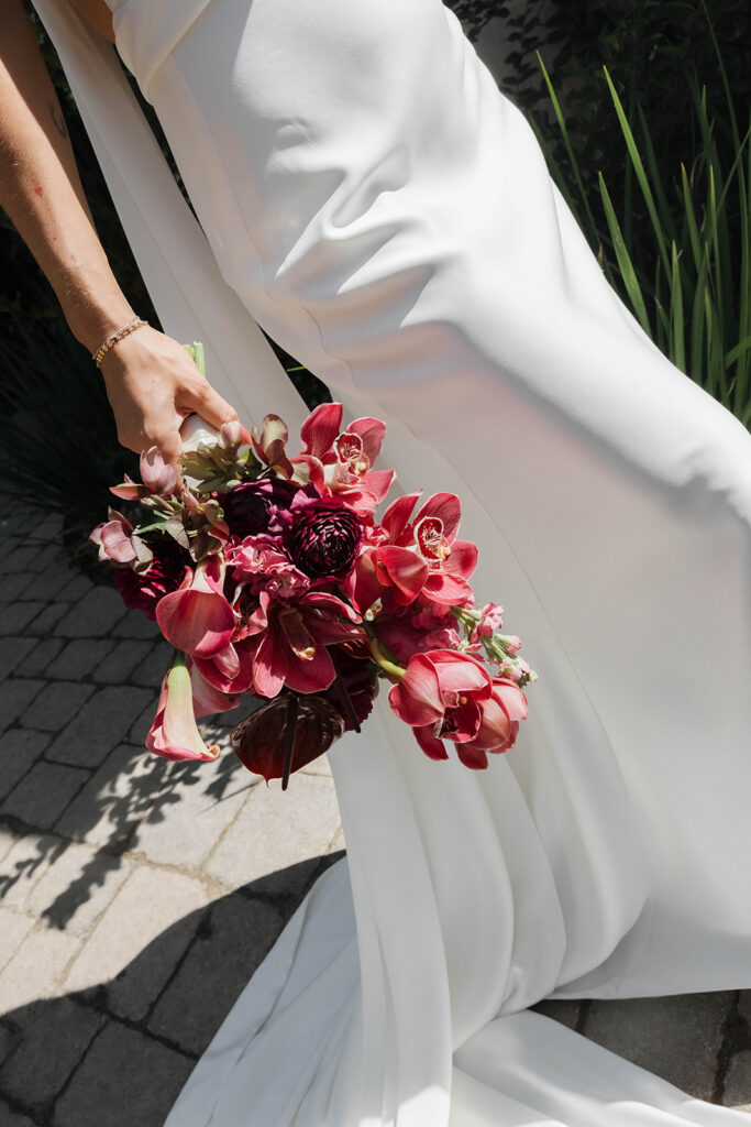 bride and groom roaming around the lush grounds of Monserate winery