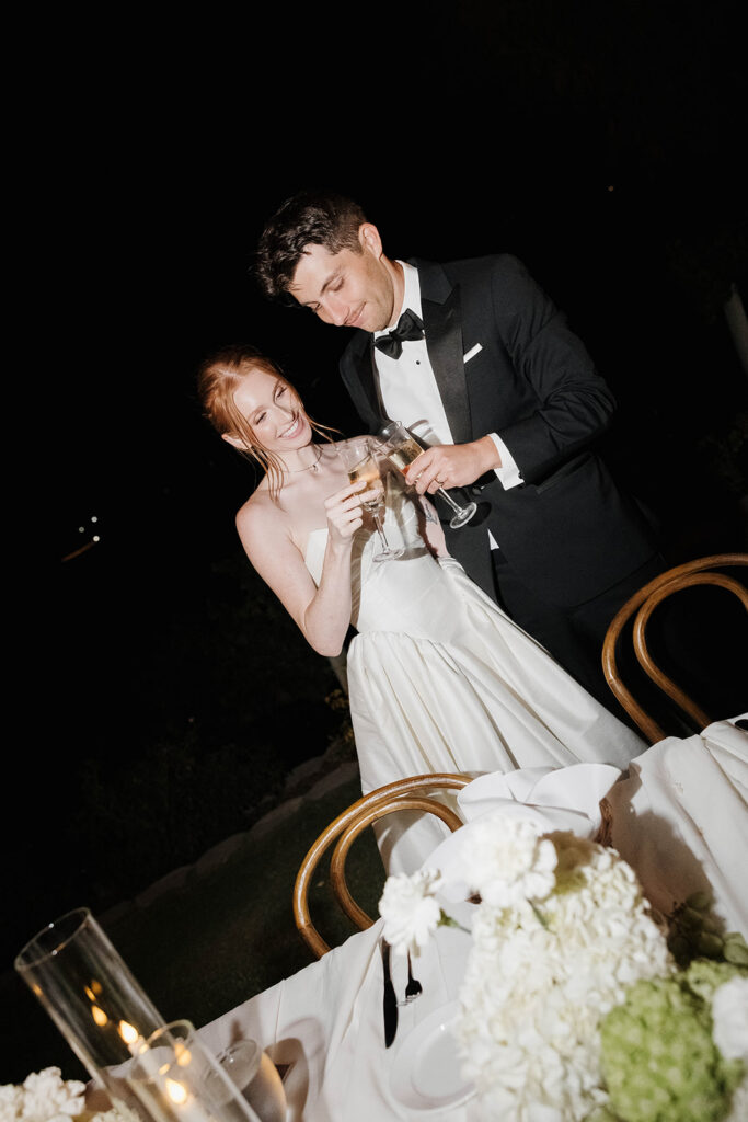 bride and groom toasting with champagne