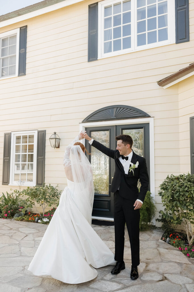 bride and groom in front of the Morgan Estate