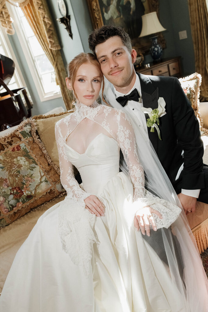 bride and groom posing inside the luxurious rooms of Morgan Estate