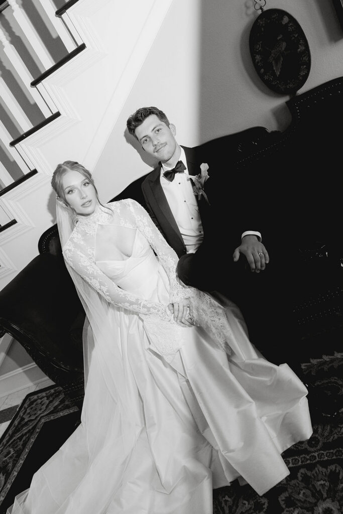 bride and groom posing inside the luxurious rooms of Morgan Estate