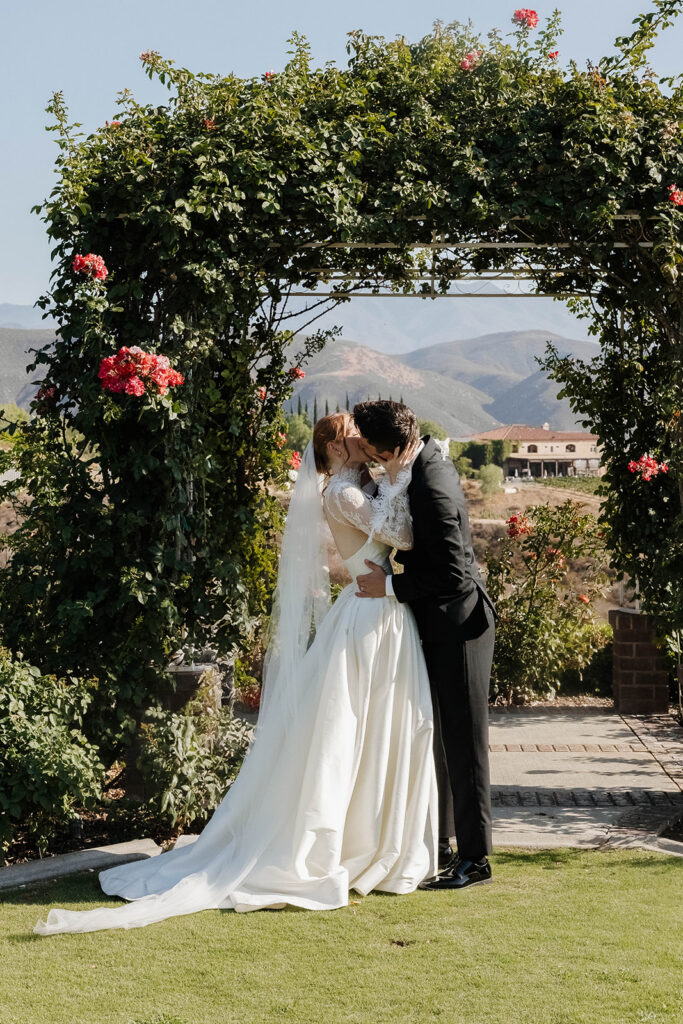 bride and groom first kiss