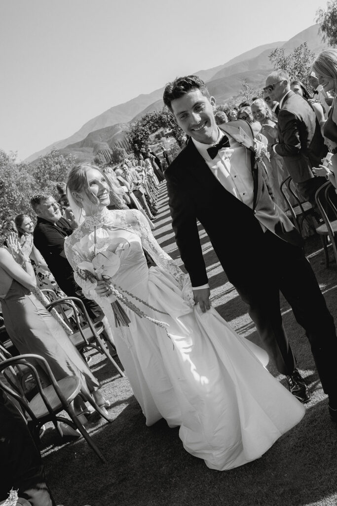 candid bride and groom wedding ceremony exit moment