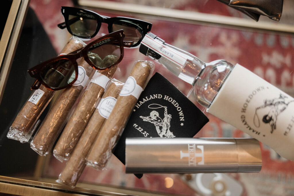 groom details of cigars, sunglasses and custom koozies