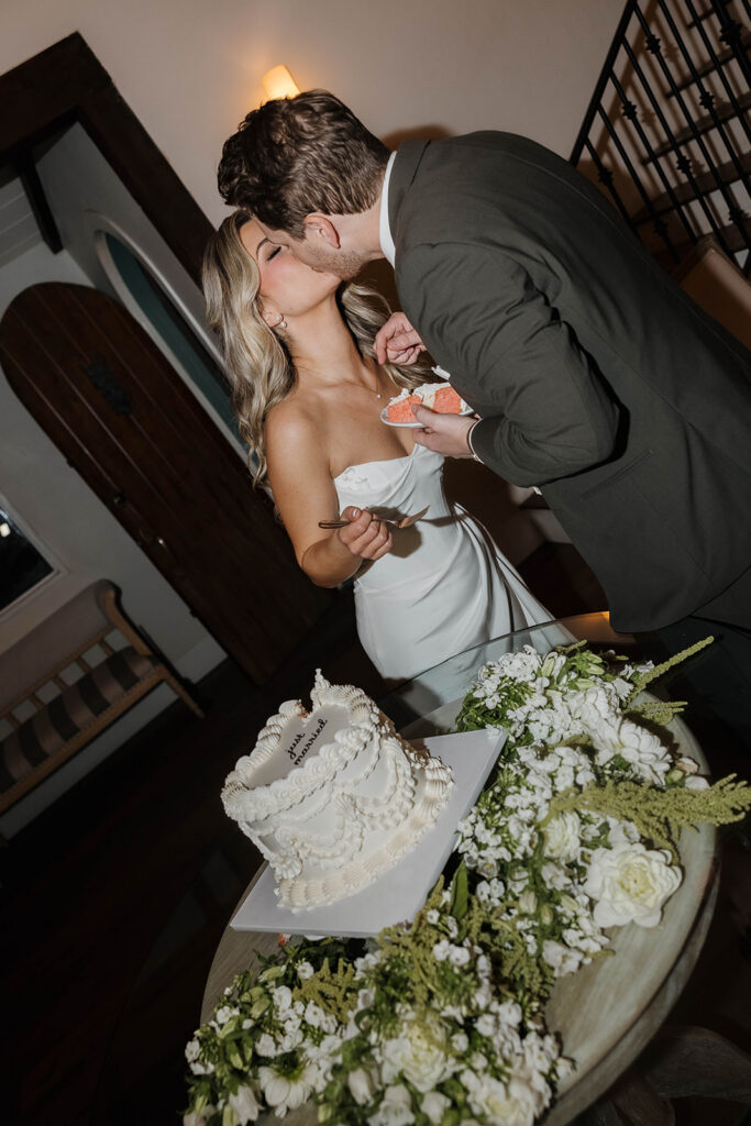 bride and groom cutting cake