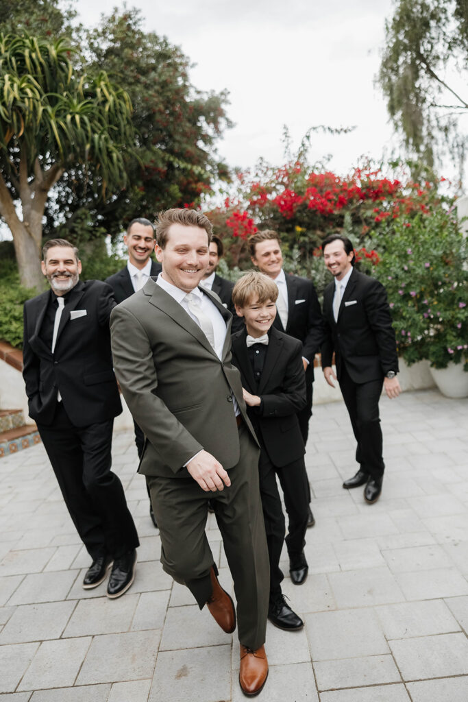 joyful groom and groomsmen