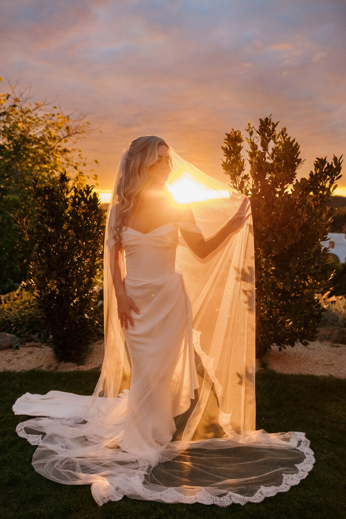 bridal portrait surrounded by rolling hills during golden hour at their california estate wedding venue