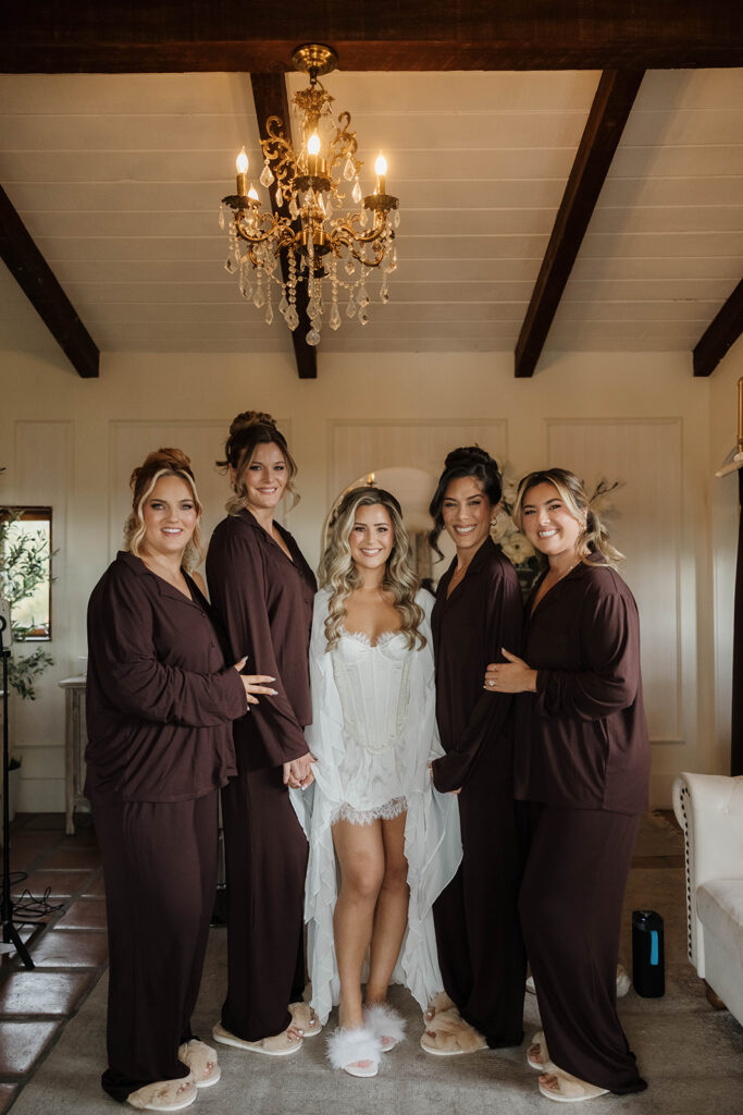 bride and bridesmaids in pjs getting ready