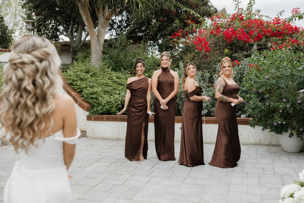 bride and bridesmaids first look