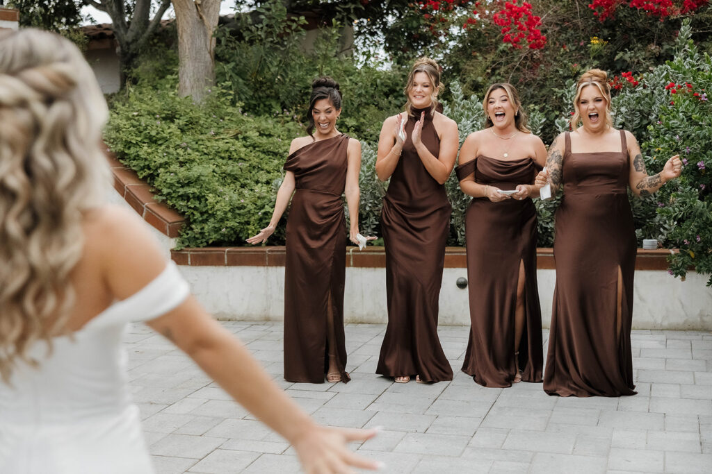 bride and bridesmaids first look