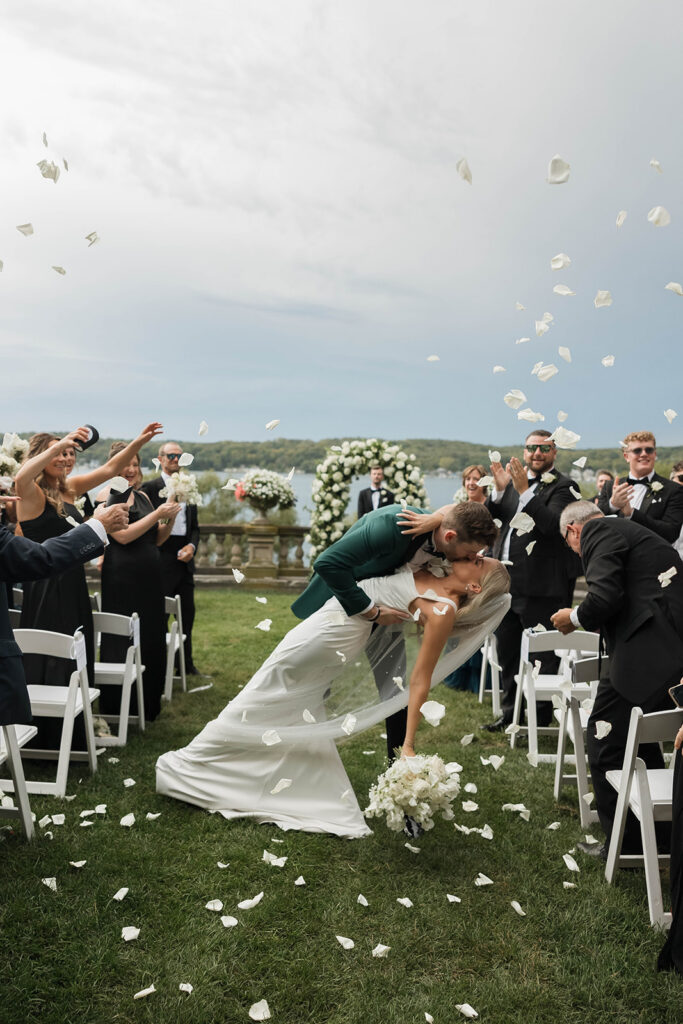 joyful bride and groom wedding ceremony exit kiss