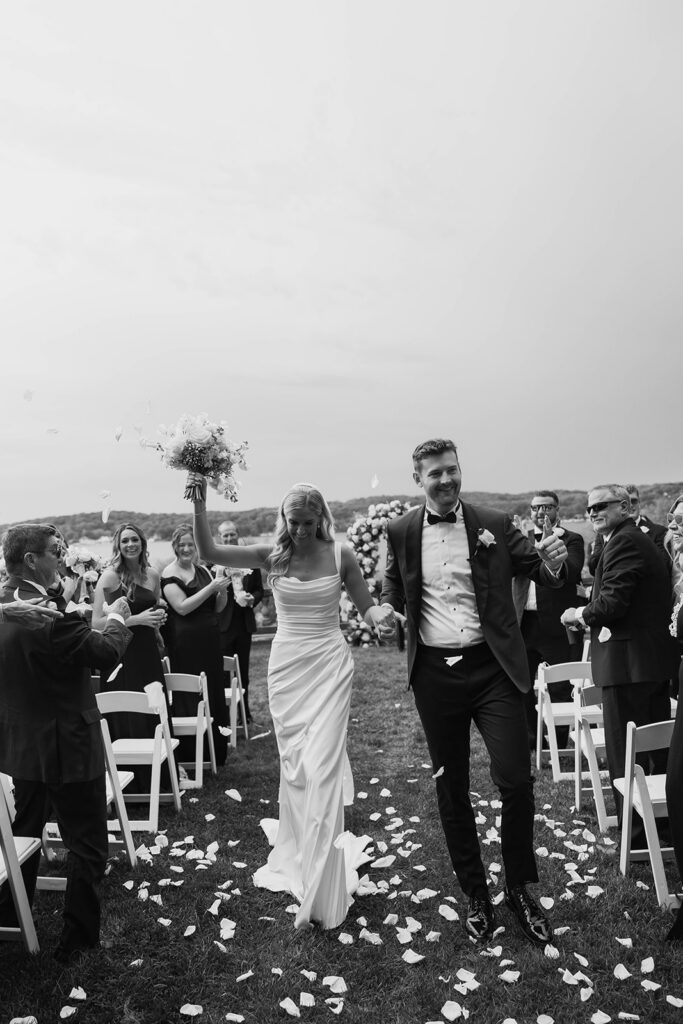 joyful bride and groom wedding ceremony exit