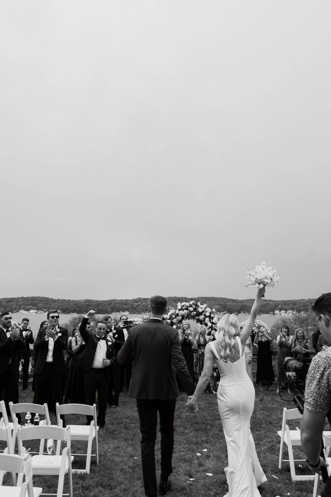 bride and groom at the lakefront ceremony space at stone manor in lake geneva, wisconsin