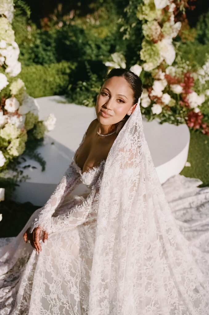 bridal portrait in lace dress in the lush grounds of rancho bernardo inn