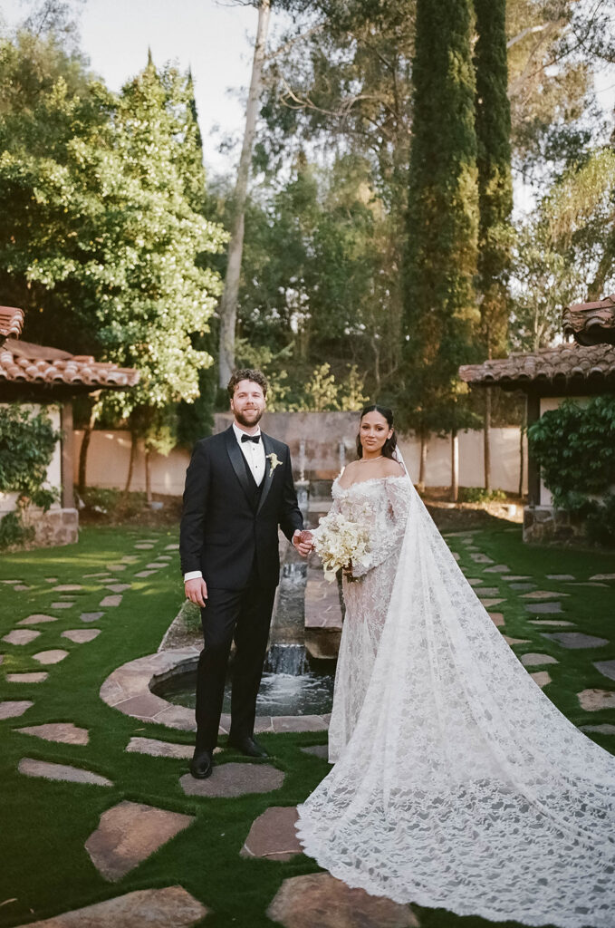 elegant wedding couple in the lush grounds of rancho bernardo inn
