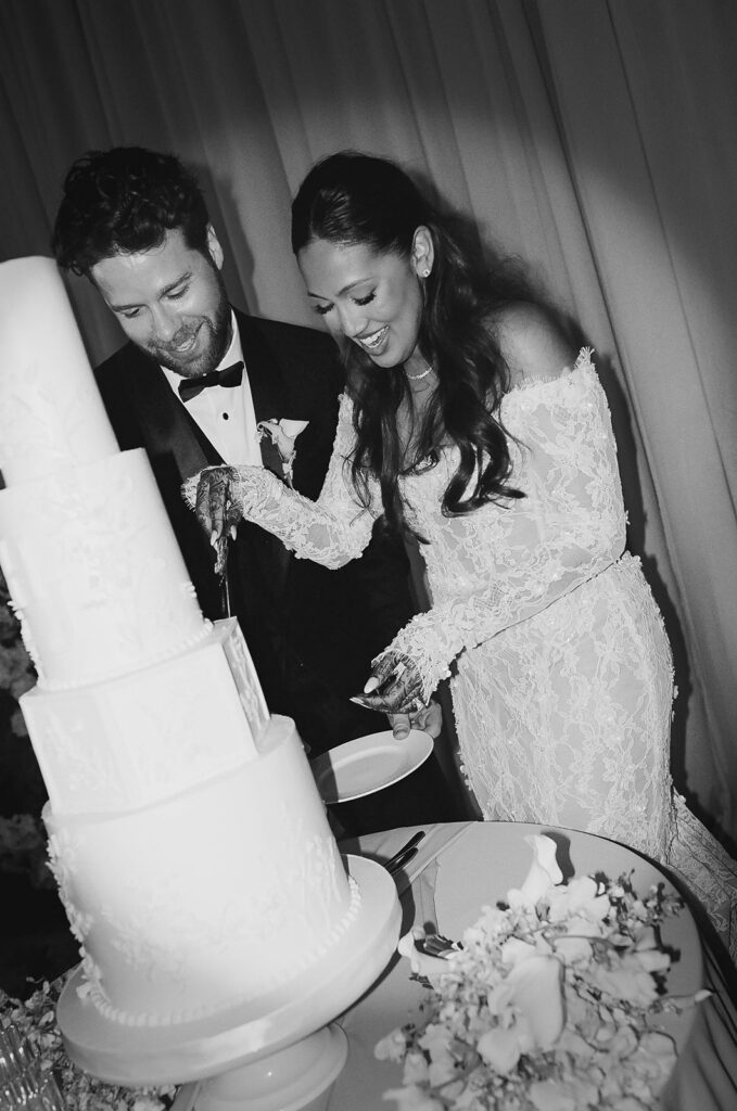 bride and groom wedding cake cutting