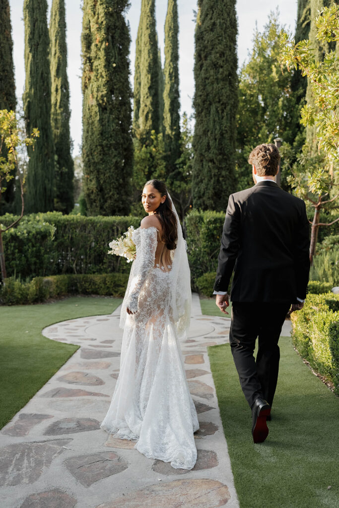 bride and groom walking during their rancho bernardo inn wedding 