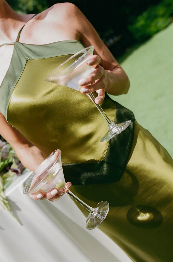 bridesmaid holding martini glasses