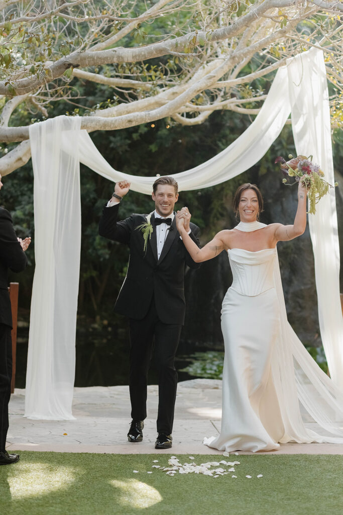 joyful bride and groom after the ceremony