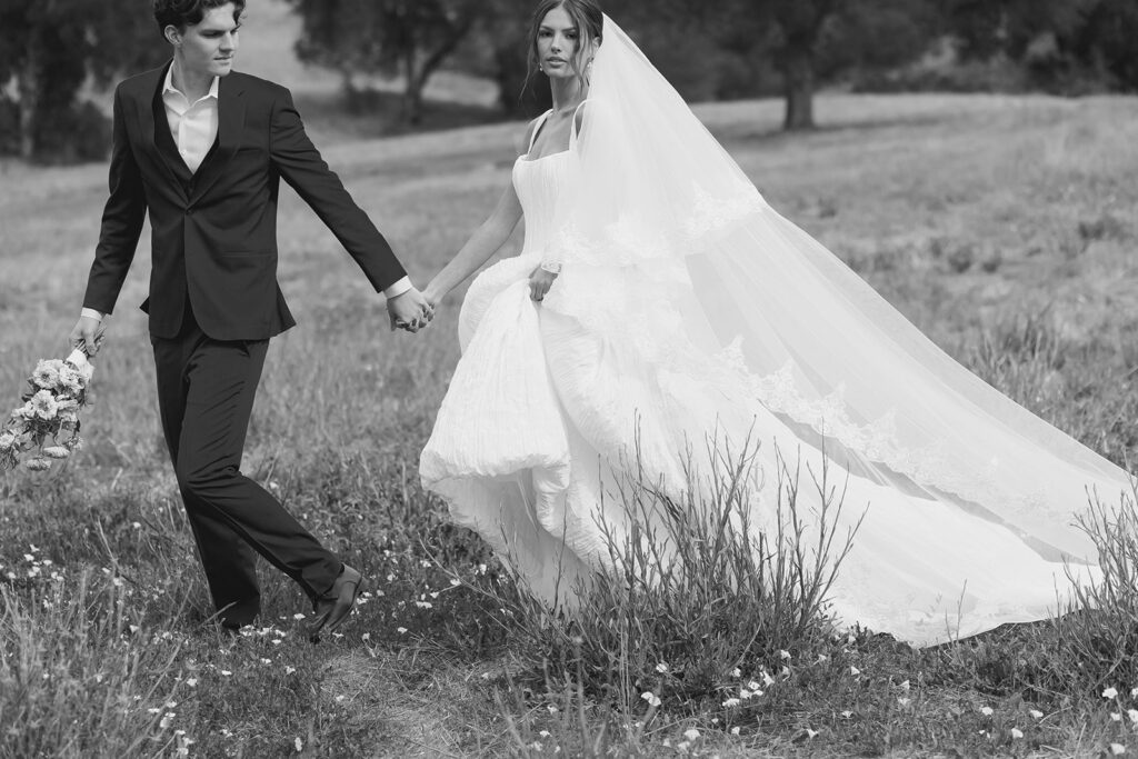 bride and groom wandering around the olive branch ranch property