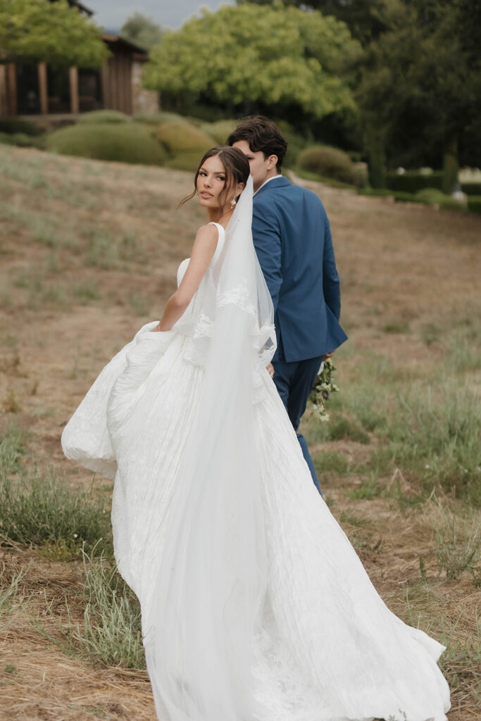 bride and groom wandering around the olive branch ranch property