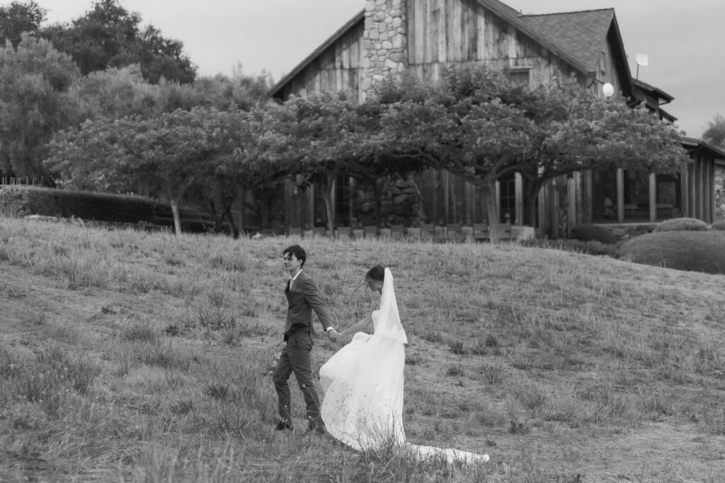 bride and groom wandering around the olive branch ranch property