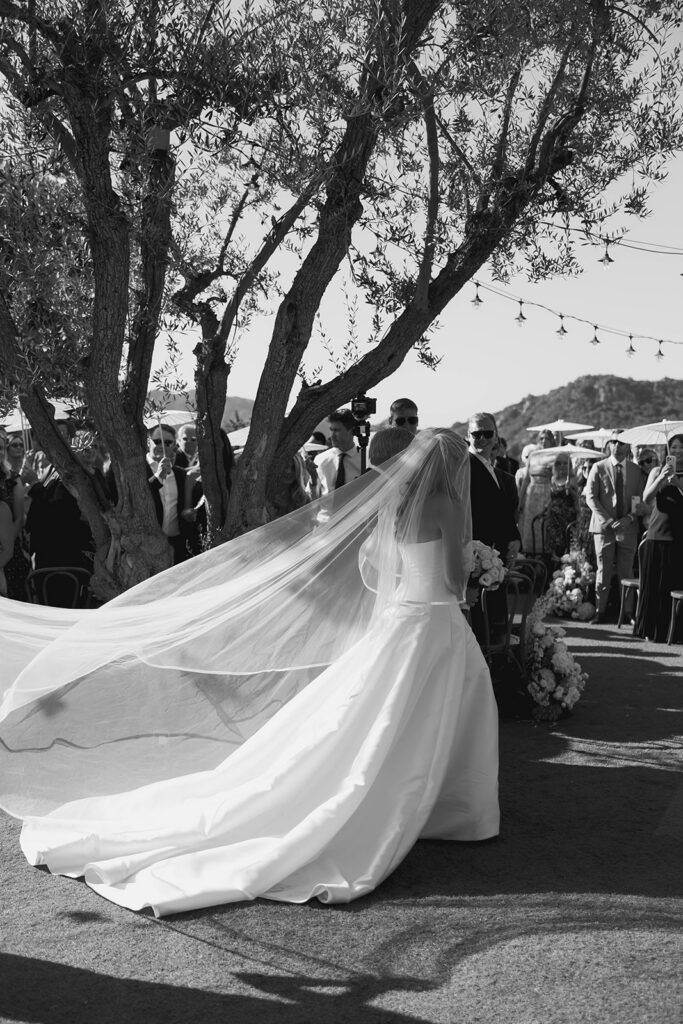 candid bride and bridesmaids portraits in front of a vintage car
